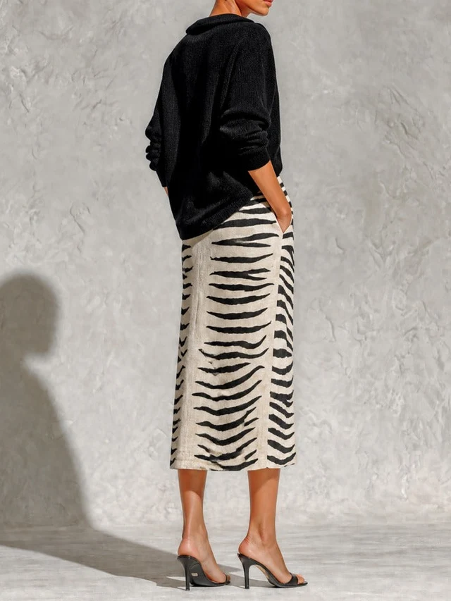 Colette | Conjunto de jersey cuello pico y falda midi cebra